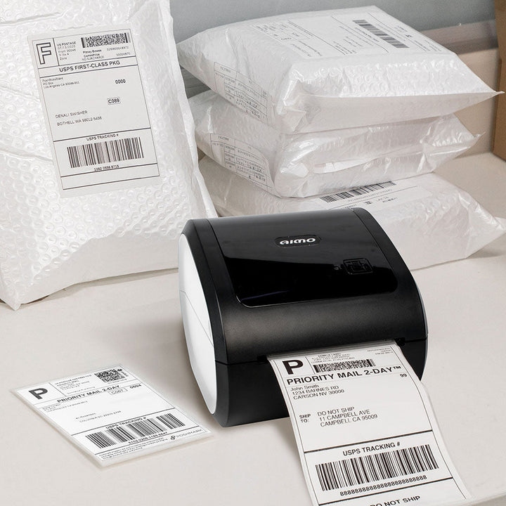 AIMO D520BT thermal printer by Dabbous Mega Supplies printing shipping labels with bubble mailers in background